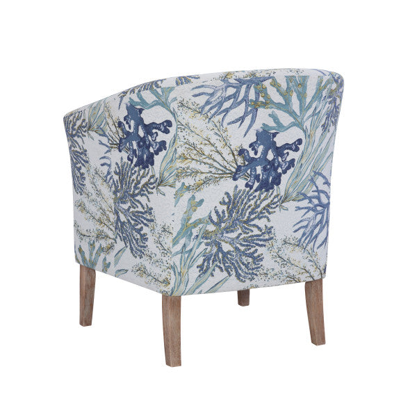 Three quarter back view armchair blue ocean coral pattern fabric wooden legs white background