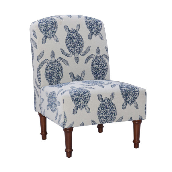 Three quarter front view armless accent chair cream fabric turtle pattern in cream turned wooden legs white background