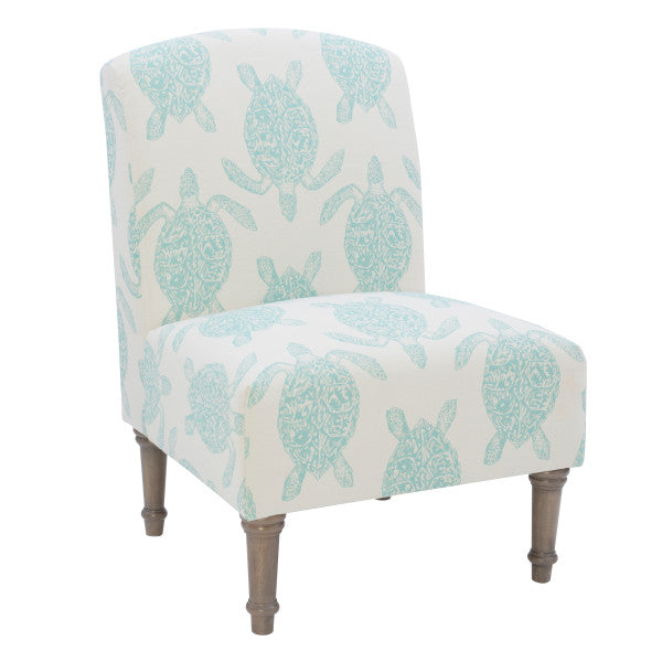 Three quarter front view armless accent chair cream fabric turtle pattern in teal turned wooden legs white background